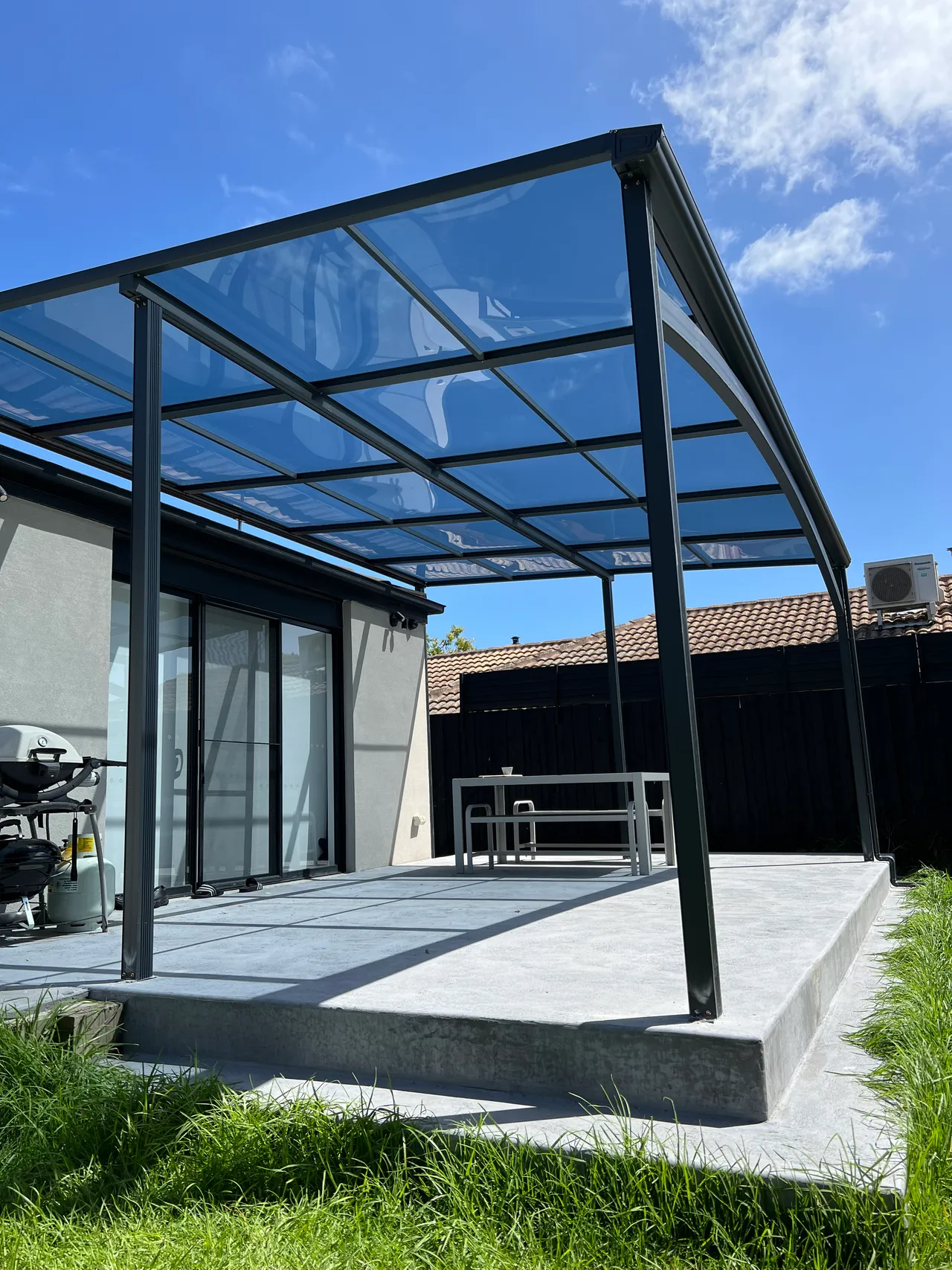 Wide-span Clearview Patio with dark framing in Bentleigh