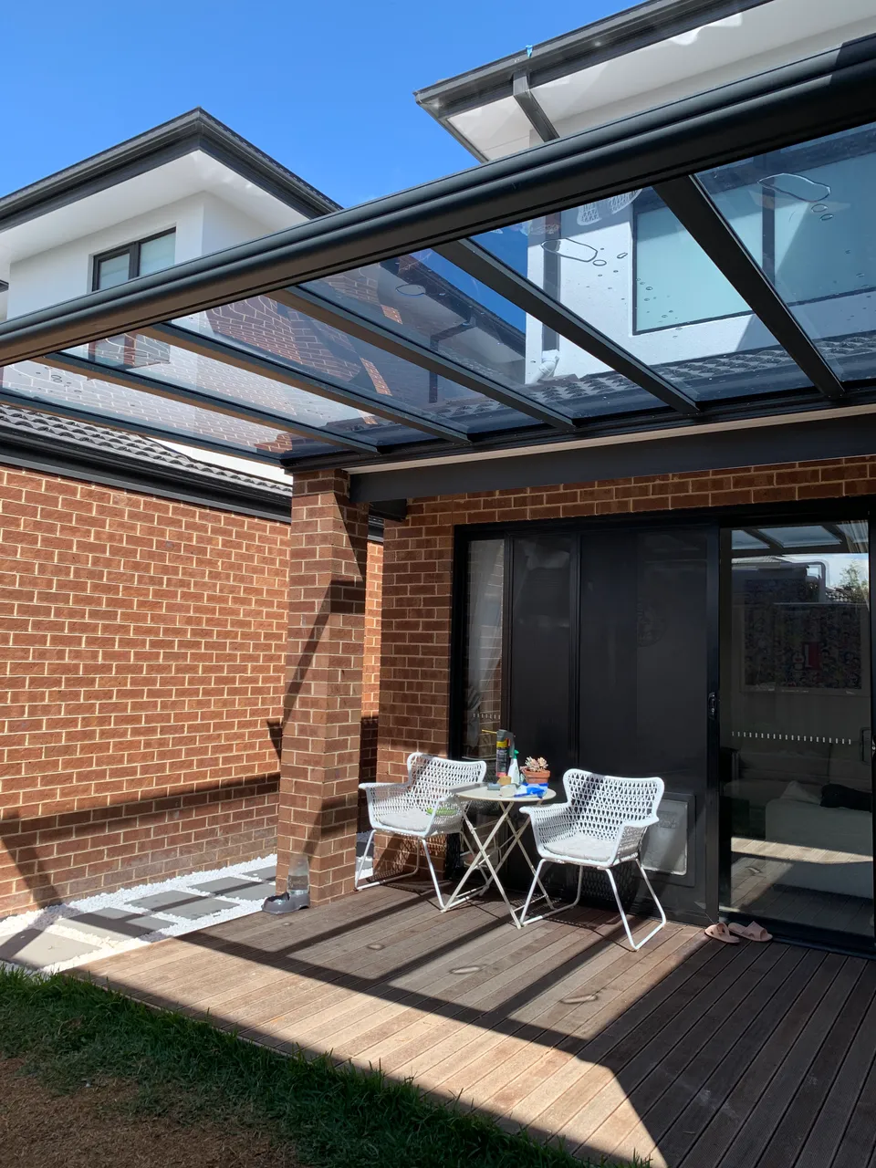 Covered seating area under a Clearview Patio roof