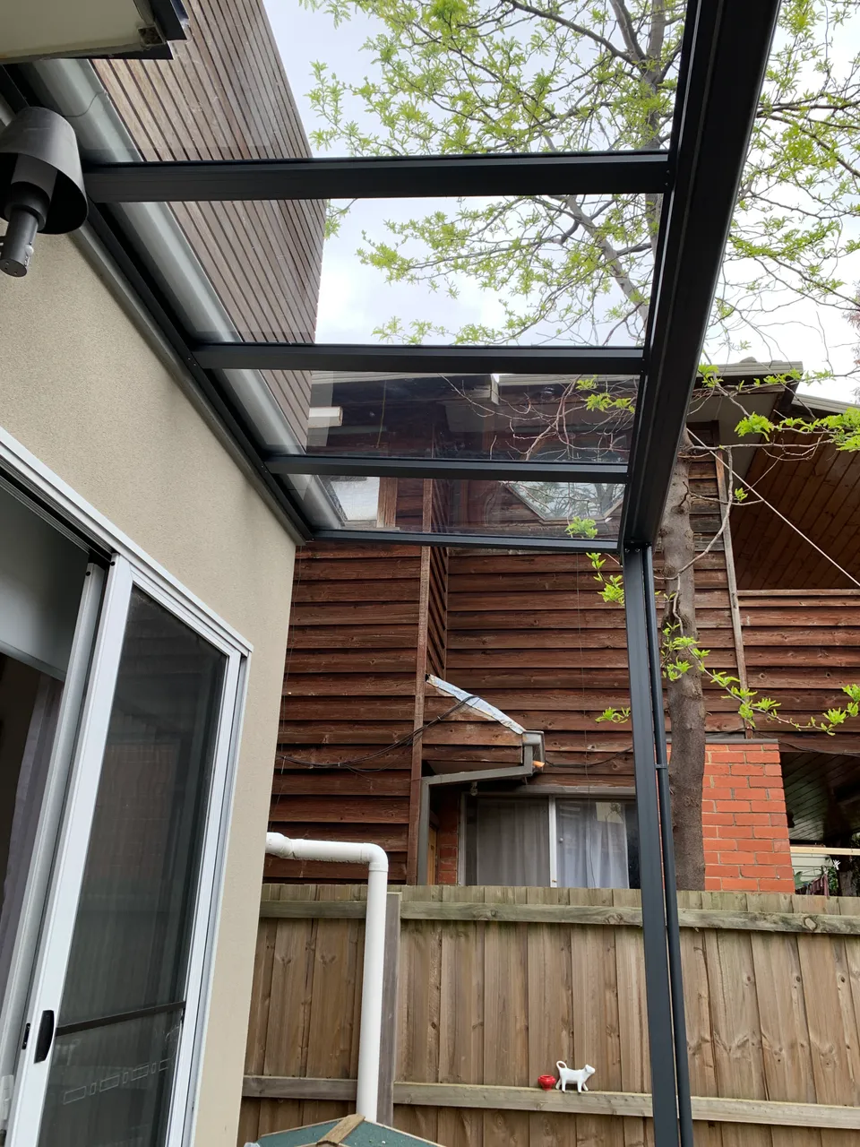 Clear polycarbonate patio roof panels in daylight