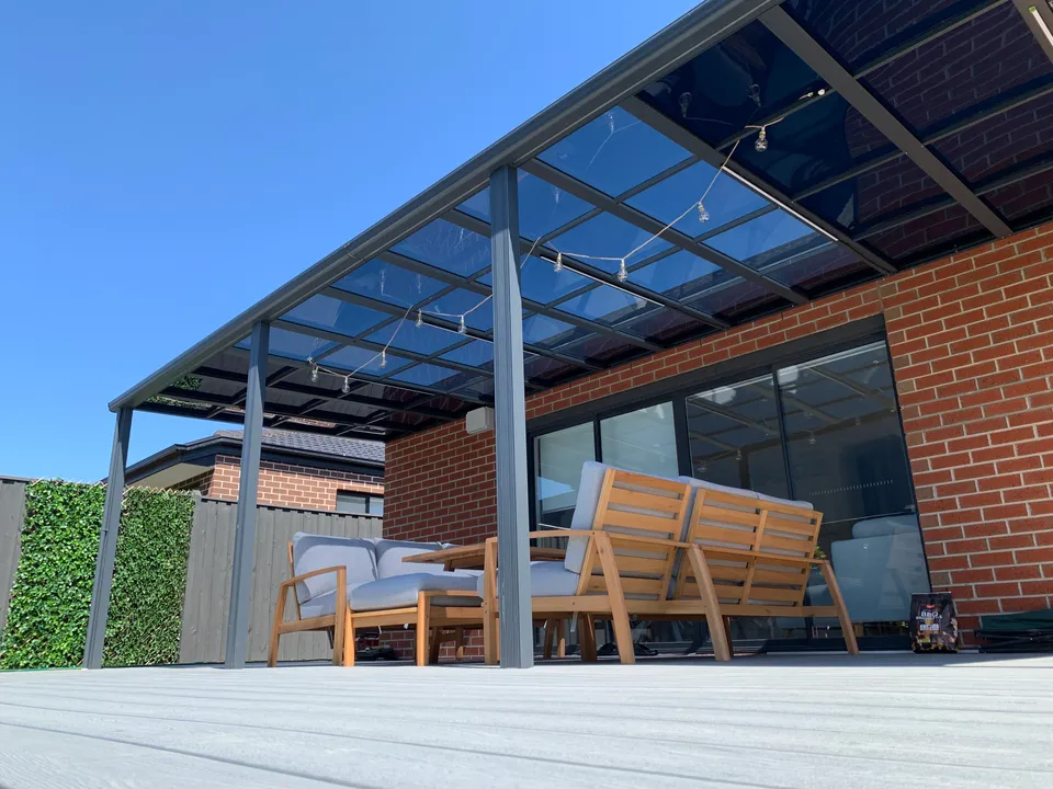 Attached Clearview patio roof beside a brick Melbourne home
