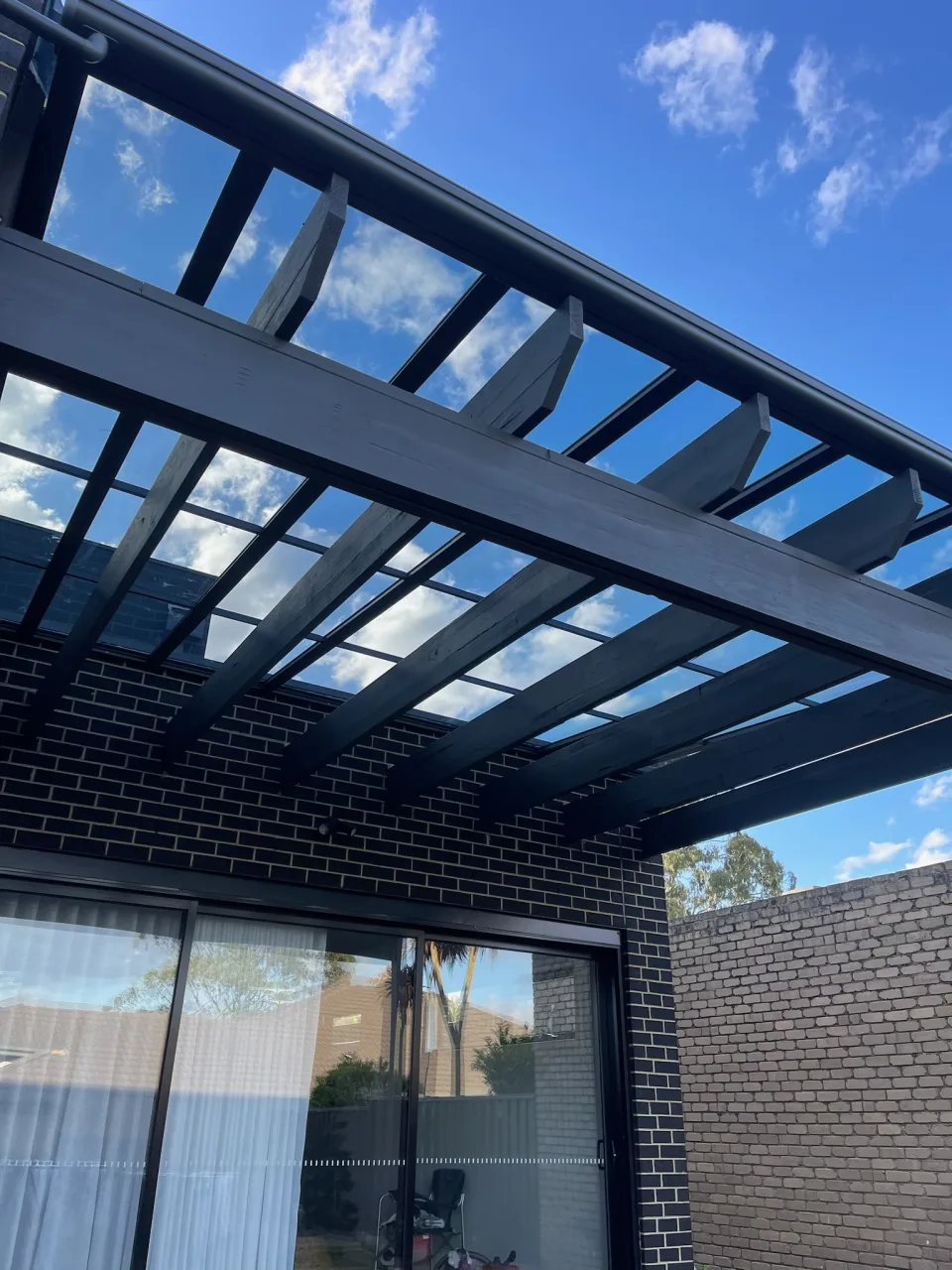 Clearview panels and slim supporting frame positioned above the existing timber rafters