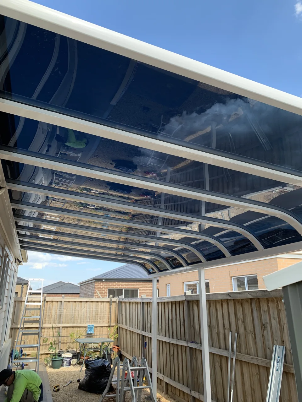 Medium Clearview patio roof panels over a backyard area
