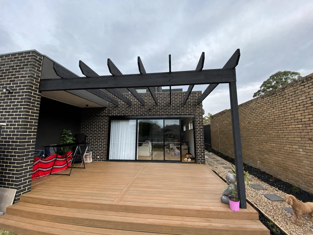 Full view of the existing open pergola before Clearview transparent roofing was installed